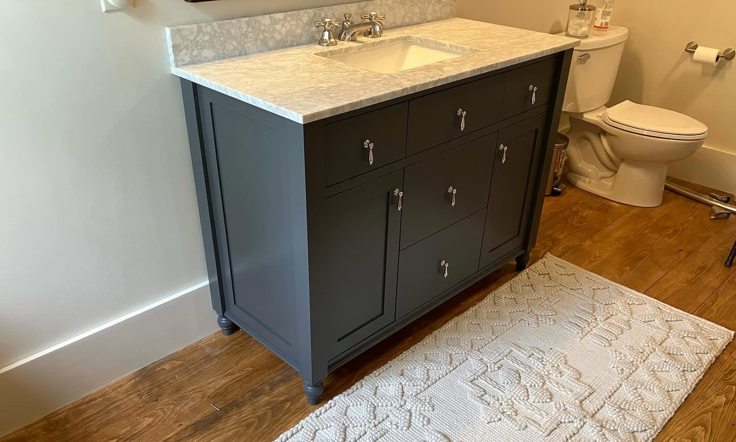 Bathroom remodel with marble-top vanity
