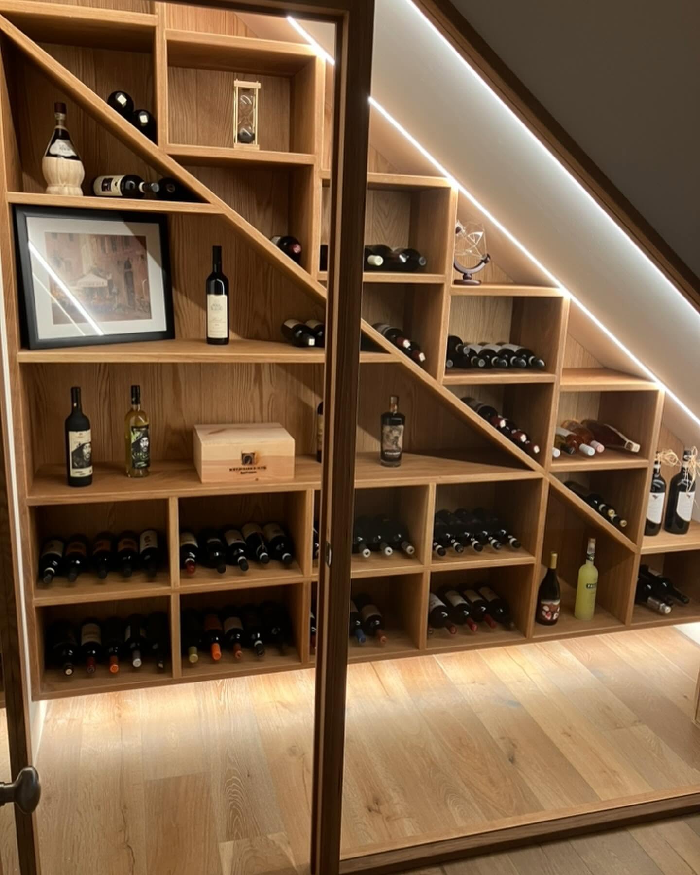 Under-stair wine cellar with custom oak racking